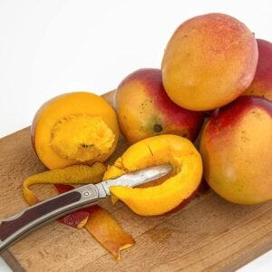 Sliced Fruits on Chopping Board With Knife